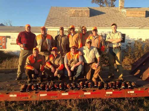 Bird hunters with the morning's birds on the prairie near Wall, South Dakota