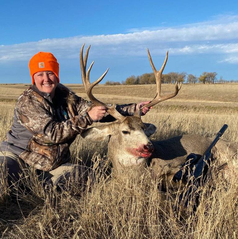 Guide and hunter with a South Dakota buck
