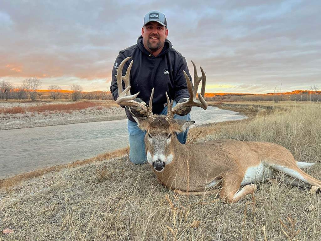 Hunters at the end of a successful South Dakota deer hunt